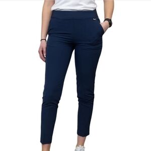 Greg Norman women’s woven pull-on golf pants in classic blue.